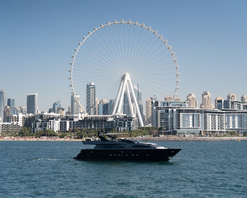 Spectre yacht with Ain Dubai ferris wheel backdrop